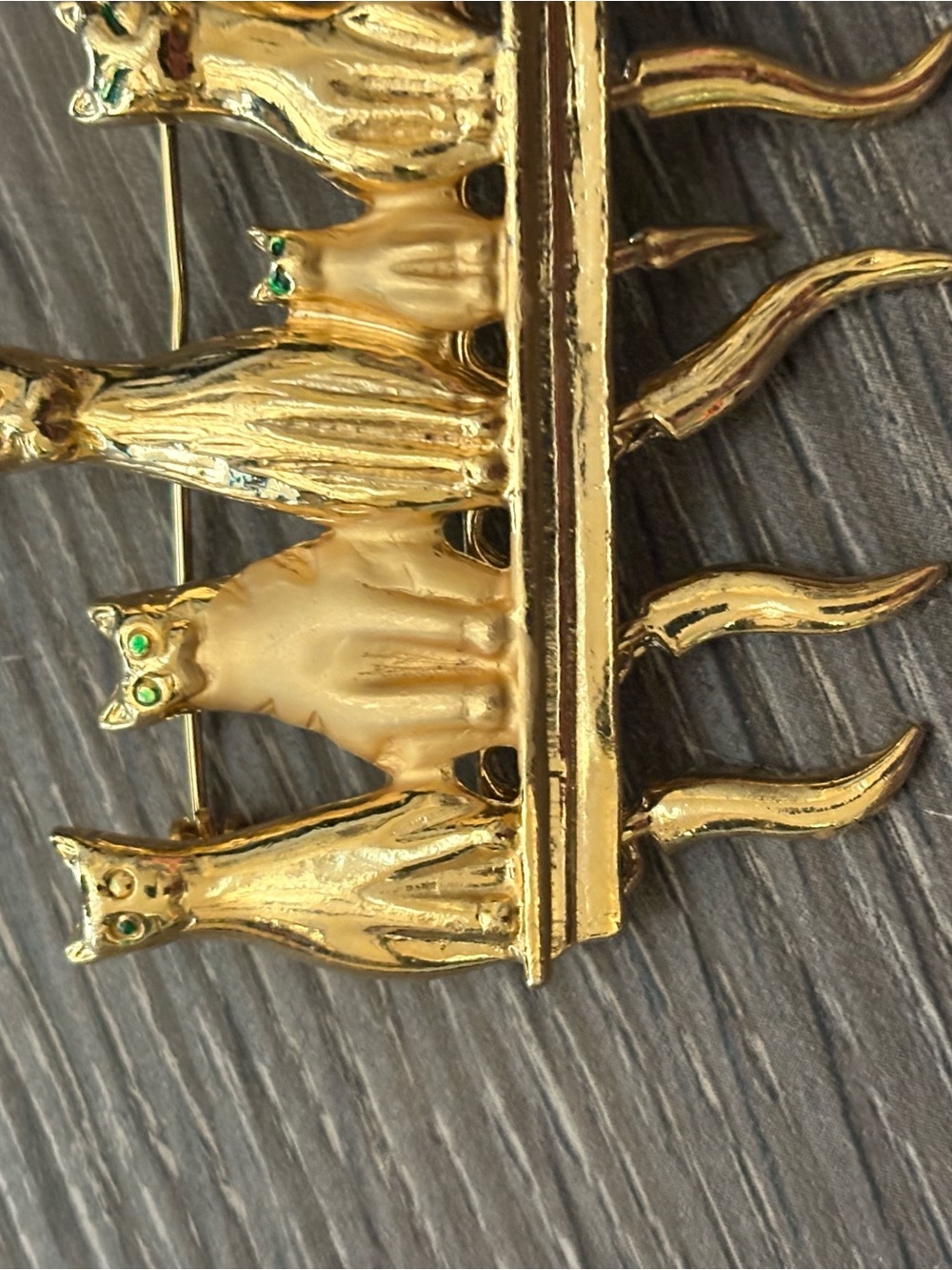 Gold-tone Cat Row Brooch with Green Eyes